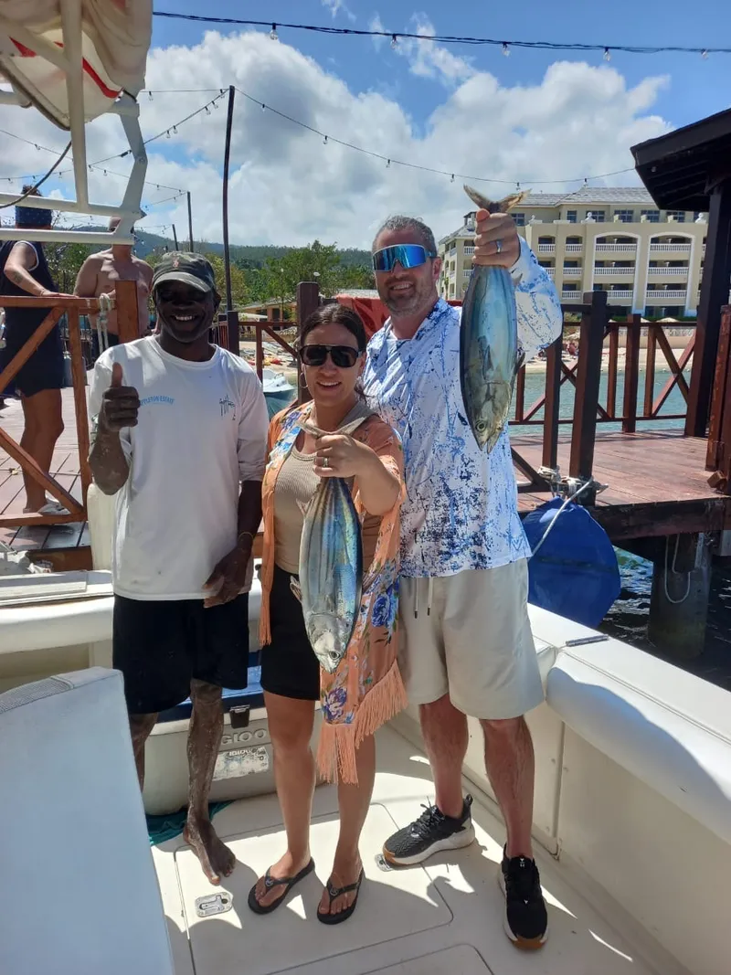 Couple posing with yellowfin tuna caught off Montego Bay