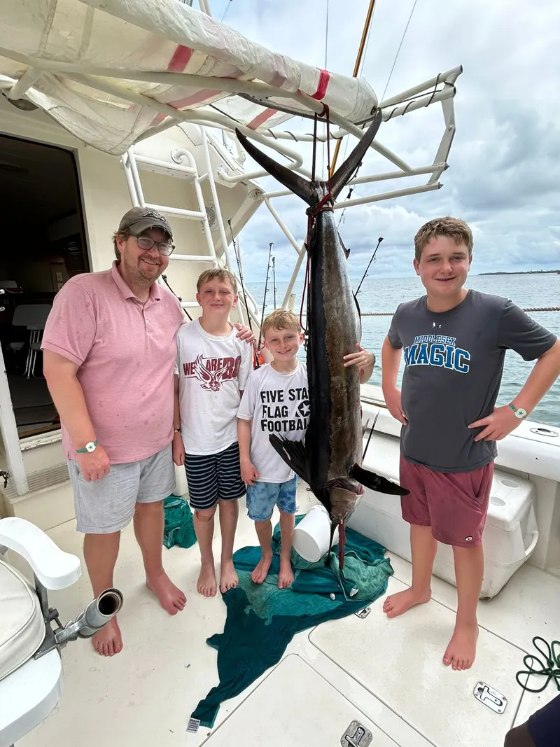 Family with a trophy catch aboard Vodka Shot