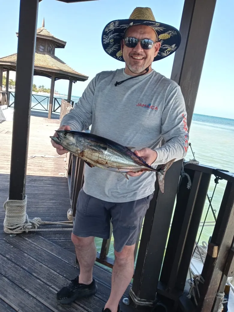 Happy angler with a tuna at the Iberostar Rose Hall Marina