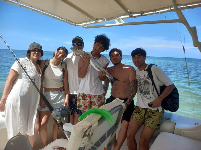 Family showing their catch from a reef trip in Montego Bay